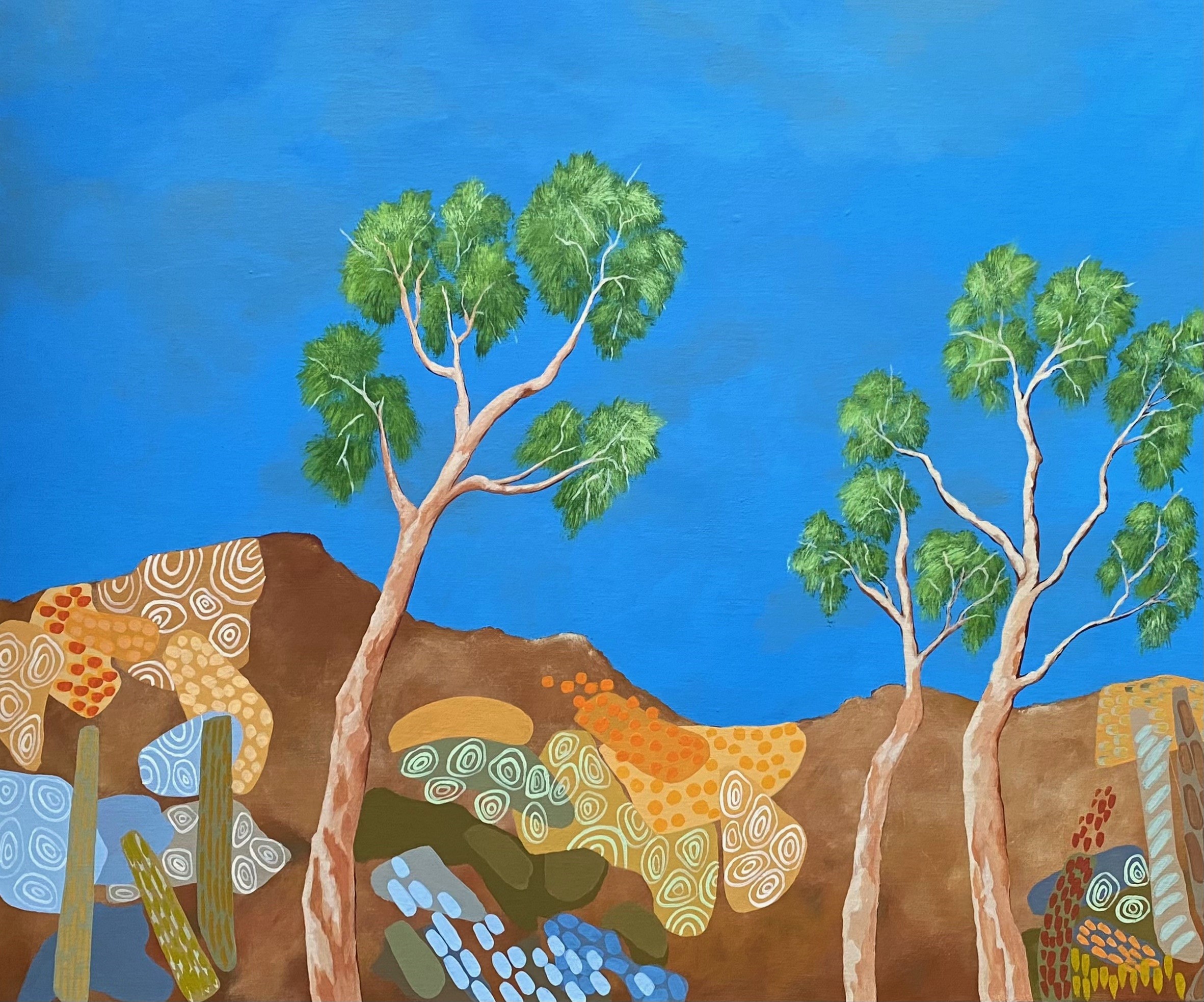 A painting of three trees in front of a bright blue sky and patterned mountains.