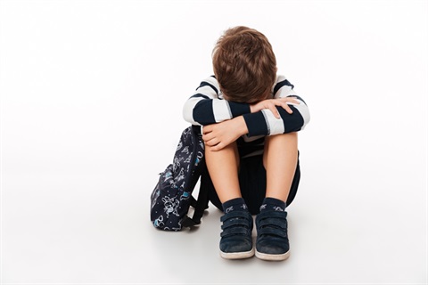 portrait-upset-sad-little-kid-with-backpack