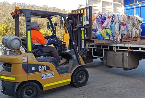 Soft plastics trial - loading plastic bales.jpg