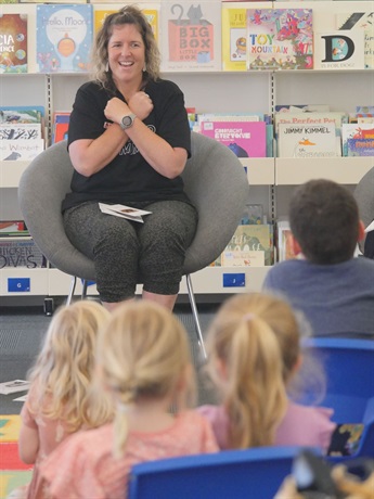 Renee d'Offay signing 'Koala' to children at Torquay Library storytime.